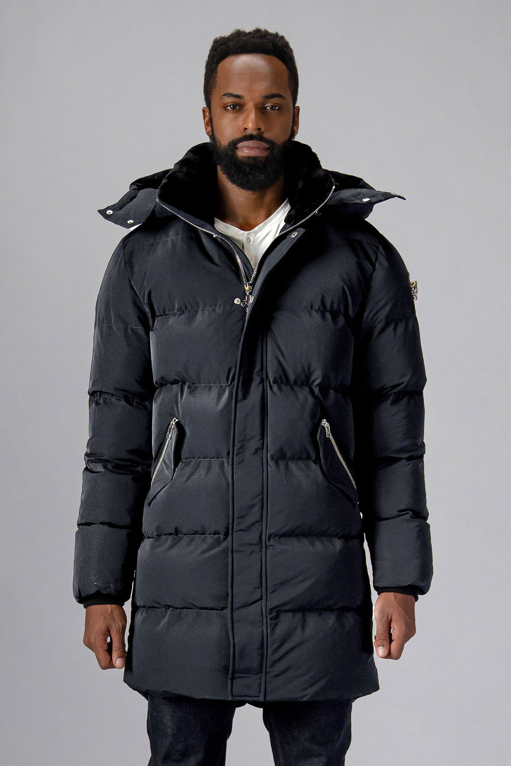 Woodpecker Men's Penguin Long Winter coat. High-end Canadian designer winter coat for men in "Black Diamond" colour. Woodpecker cruelty-free winter coat designed in Canada. Men's heavy weight long length premium designer jacket for winter. Superior quality warm winter coat for men. Moose Knuckles, Canada Goose, Mackage, Montcler, Will Poho, Willbird, Nic Bayley. Extra warm. Shiny parka. Stylish winter jacket. Designer winter coat.