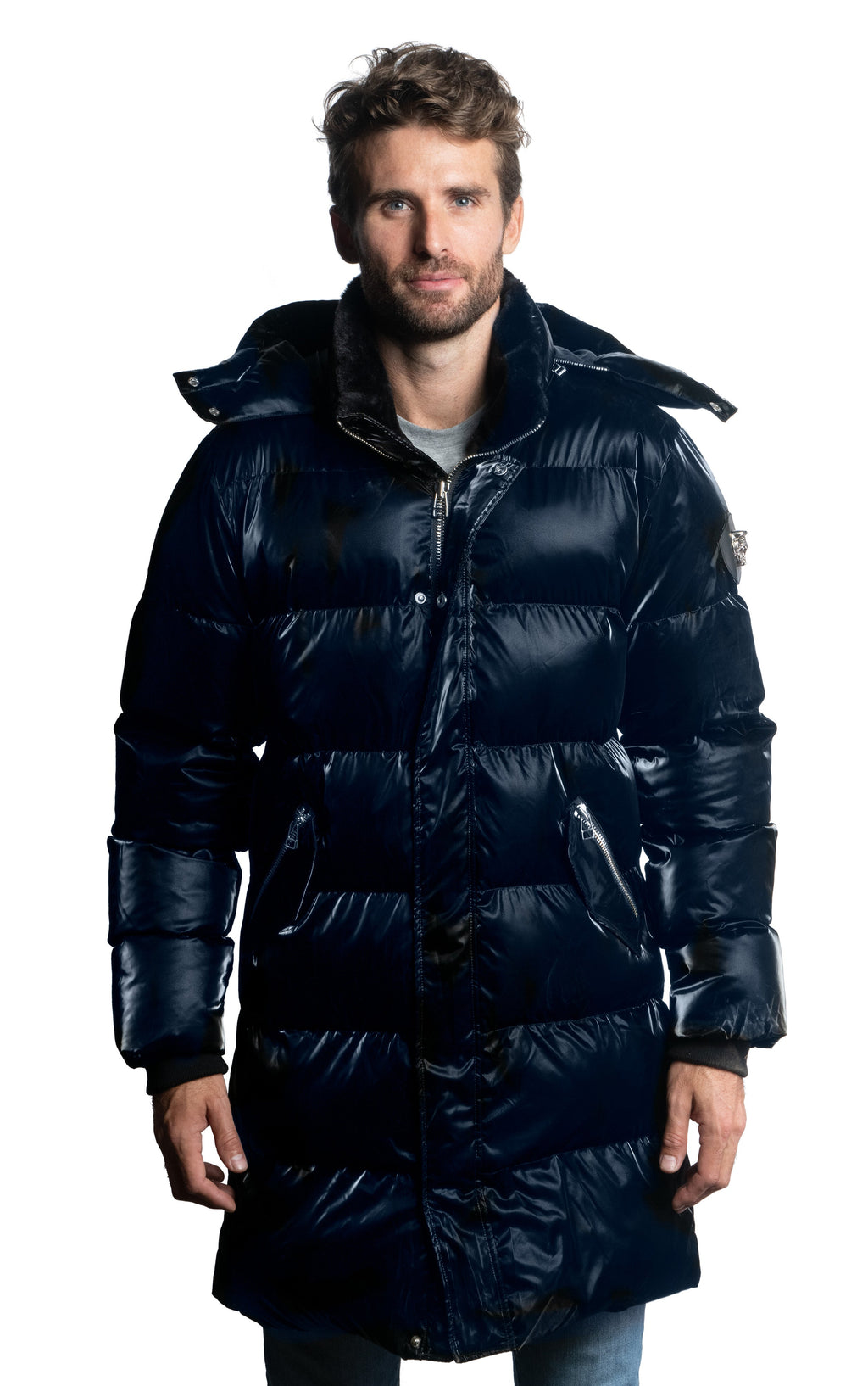 Woodpecker Men's Penguin Long Winter coat. High-end Canadian designer winter coat for men in shiny "All Wet Blue" navy blue colour. Woodpecker cruelty-free winter coat designed in Canada. Men's heavy weight long length premium designer jacket for winter. Superior quality warm winter coat for men. Moose Knuckles, Canada Goose, Mackage, Montcler, Will Poho, Willbird, Nic Bayley