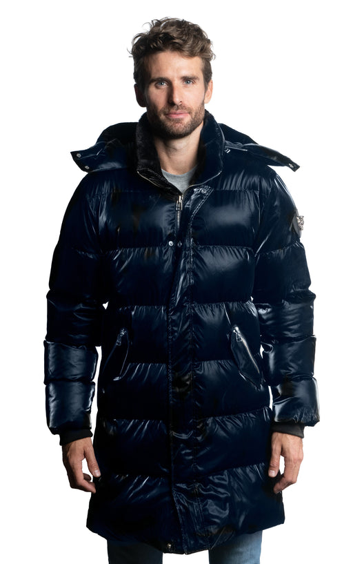 Woodpecker Men's Penguin Long Winter coat. High-end Canadian designer winter coat for men in shiny "All Wet Blue" navy blue colour. Woodpecker cruelty-free winter coat designed in Canada. Men's heavy weight long length premium designer jacket for winter. Superior quality warm winter coat for men. Moose Knuckles, Canada Goose, Mackage, Montcler, Will Poho, Willbird, Nic Bayley