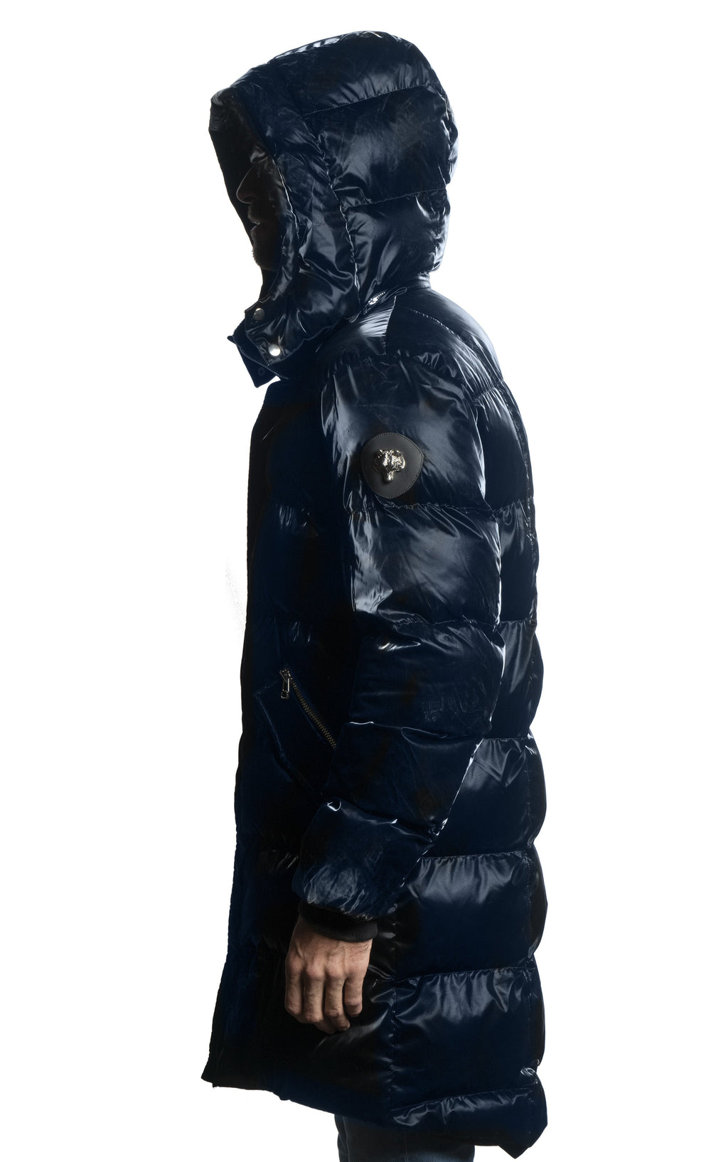 Woodpecker Men's Penguin Long Winter coat. High-end Canadian designer winter coat for men in shiny "All Wet Blue" navy blue colour. Woodpecker cruelty-free winter coat designed in Canada. Men's heavy weight long length premium designer jacket for winter. Superior quality warm winter coat for men. Moose Knuckles, Canada Goose, Mackage, Montcler, Will Poho, Willbird, Nic Bayley