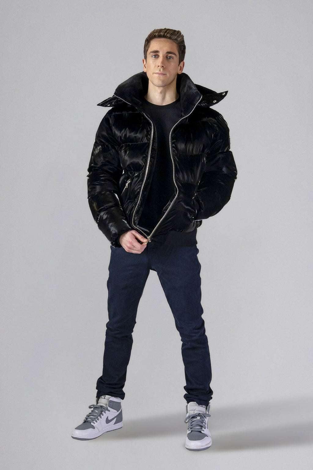 Woodpecker Men's Woody Bomber Winter coat. High-end Canadian designer winter coat for men in shiny “All Wet Black" colour. Woodpecker cruelty-free winter coat designed in Canada. Men's heavy weight short length premium designer jacket for winter. Superior quality warm winter coat for men. Moose Knuckles, Canada Goose, Mackage, Montcler, Will Poho, Willbird, Nic Bayley. Shiny parka. Stylish winter jacket. Designer winter coat.