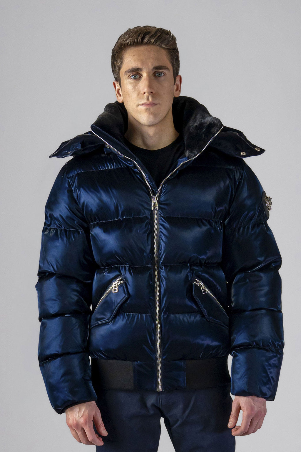 Woodpecker Men's Woody Bomber Winter coat. High-end Canadian designer winter coat for men in shiny “All Wet Navy" colour. Woodpecker cruelty-free winter coat designed in Canada. Men's heavy weight short length premium designer jacket for winter. Superior quality warm winter coat for men. Moose Knuckles, Canada Goose, Mackage, Montcler, Will Poho, Willbird, Nic Bayley. Shiny parka. Stylish winter jacket. Designer winter coat.