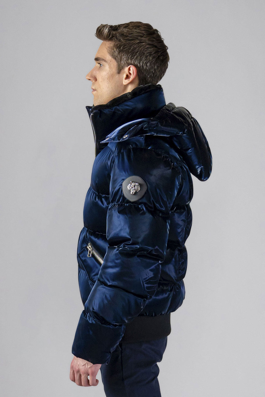 Woodpecker Men's Woody Bomber Winter coat. High-end Canadian designer winter coat for men in shiny “All Wet Navy" colour. Woodpecker cruelty-free winter coat designed in Canada. Men's heavy weight short length premium designer jacket for winter. Superior quality warm winter coat for men. Moose Knuckles, Canada Goose, Mackage, Montcler, Will Poho, Willbird, Nic Bayley. Shiny parka. Stylish winter jacket. Designer winter coat.