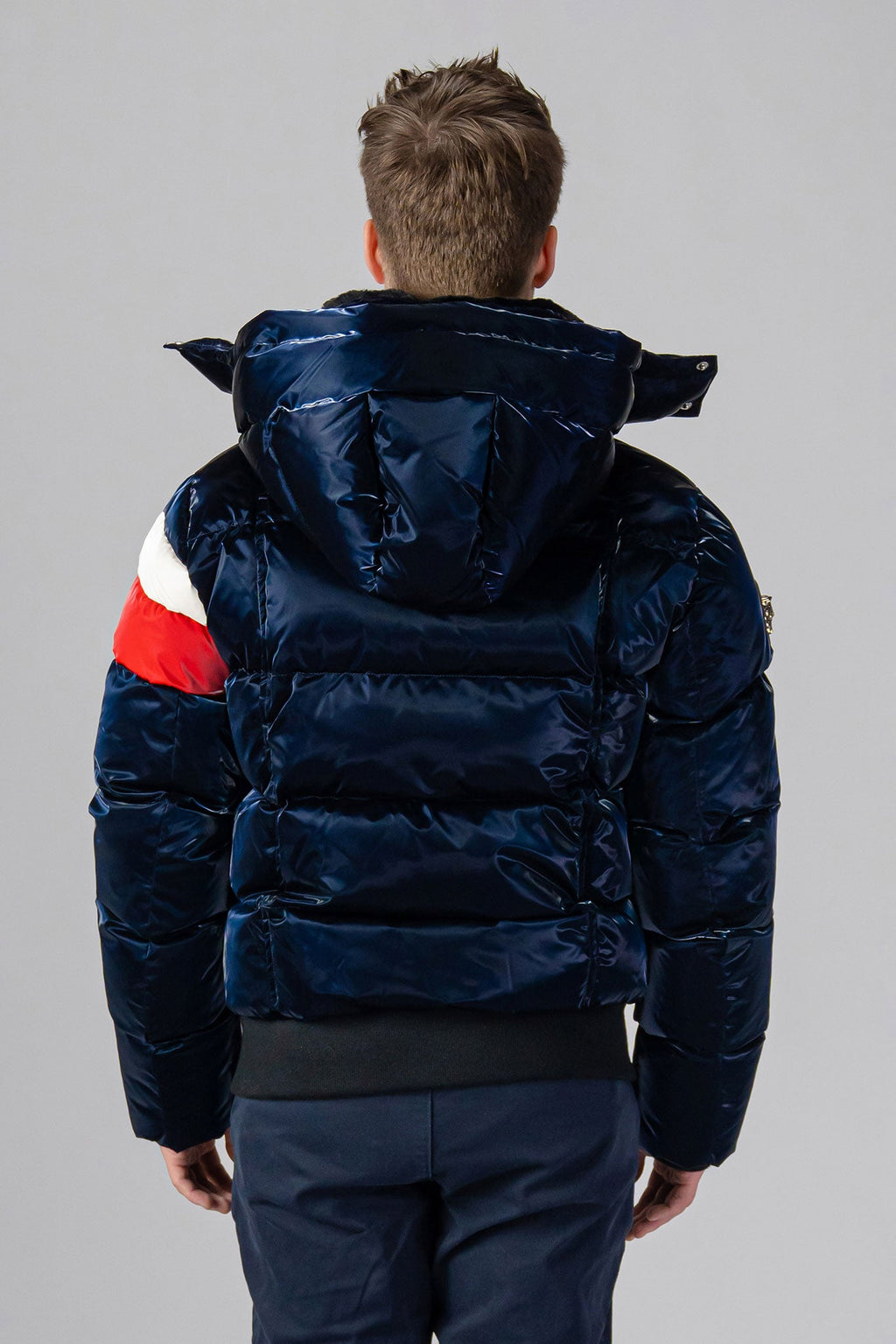 Woodpecker Men's Woody Bomber Winter coat. High-end Canadian designer winter coat for men in “Red Winged" colour. Woodpecker cruelty-free winter coat designed in Canada. Men's heavy weight short length premium designer jacket for winter. Superior quality warm winter coat for men. Moose Knuckles, Canada Goose, Mackage, Montcler, Will Poho, Willbird, Nic Bayley. Shiny parka. Stylish winter jacket. Designer winter coat.