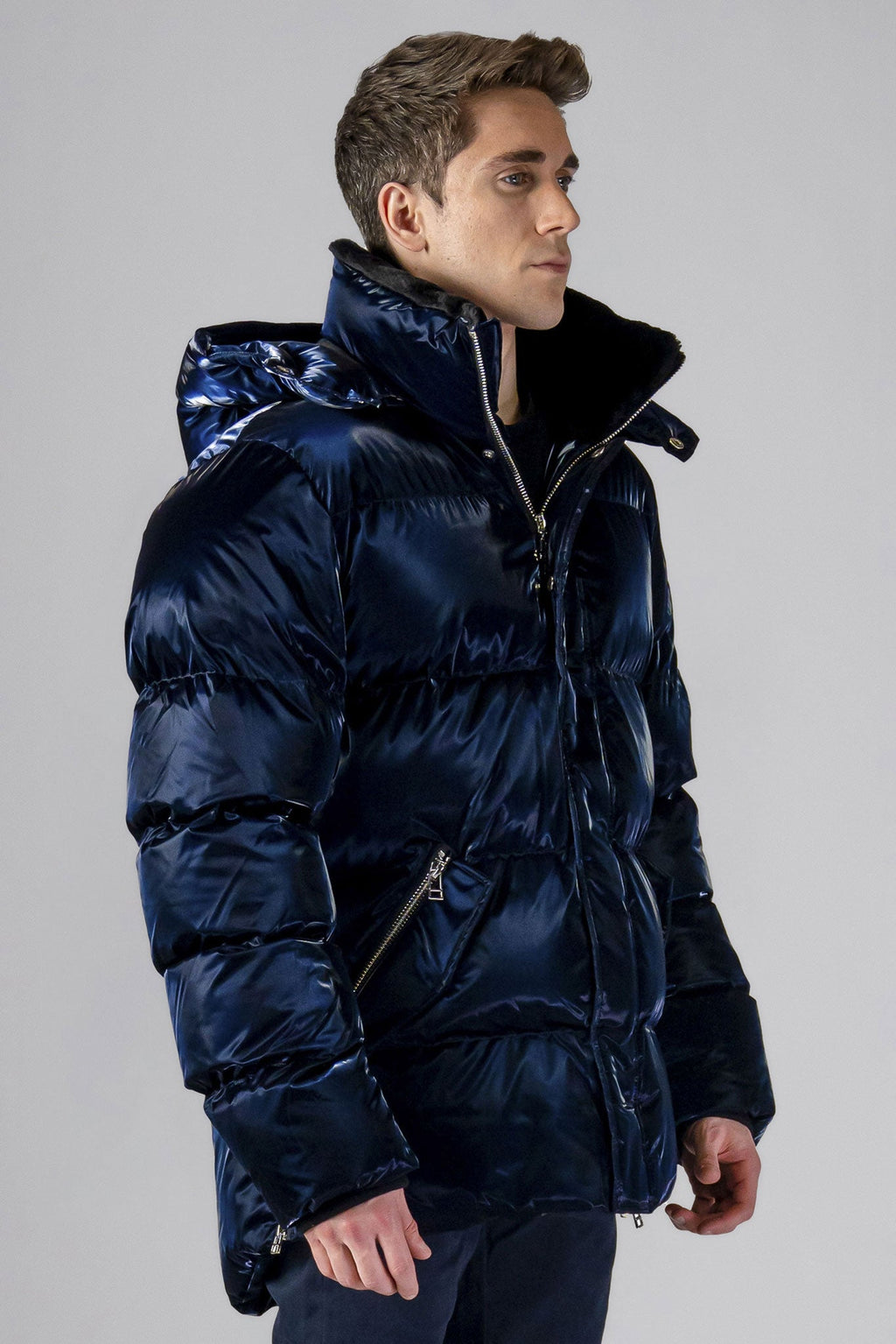 Woodpecker Men's Bumnester Winter coat. High-end Canadian designer winter coat for men in "All Wet Navy" colour. Woodpecker cruelty-free winter coat designed in Canada. Men's heavy weight medium length premium designer jacket for winter. Superior quality warm winter coat for men. Moose Knuckles, Canada Goose, Mackage, Montcler, Will Poho, Willbird, Nic Bayley. Shiny parka. Stylish winter jacket. Designer winter coat.