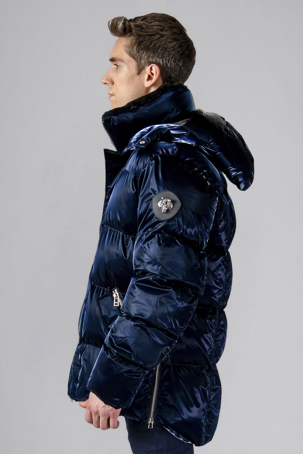 Woodpecker Men's Bumnester Winter coat. High-end Canadian designer winter coat for men in "All Wet Navy" colour. Woodpecker cruelty-free winter coat designed in Canada. Men's heavy weight medium length premium designer jacket for winter. Superior quality warm winter coat for men. Moose Knuckles, Canada Goose, Mackage, Montcler, Will Poho, Willbird, Nic Bayley. Shiny parka. Stylish winter jacket. Designer winter coat.