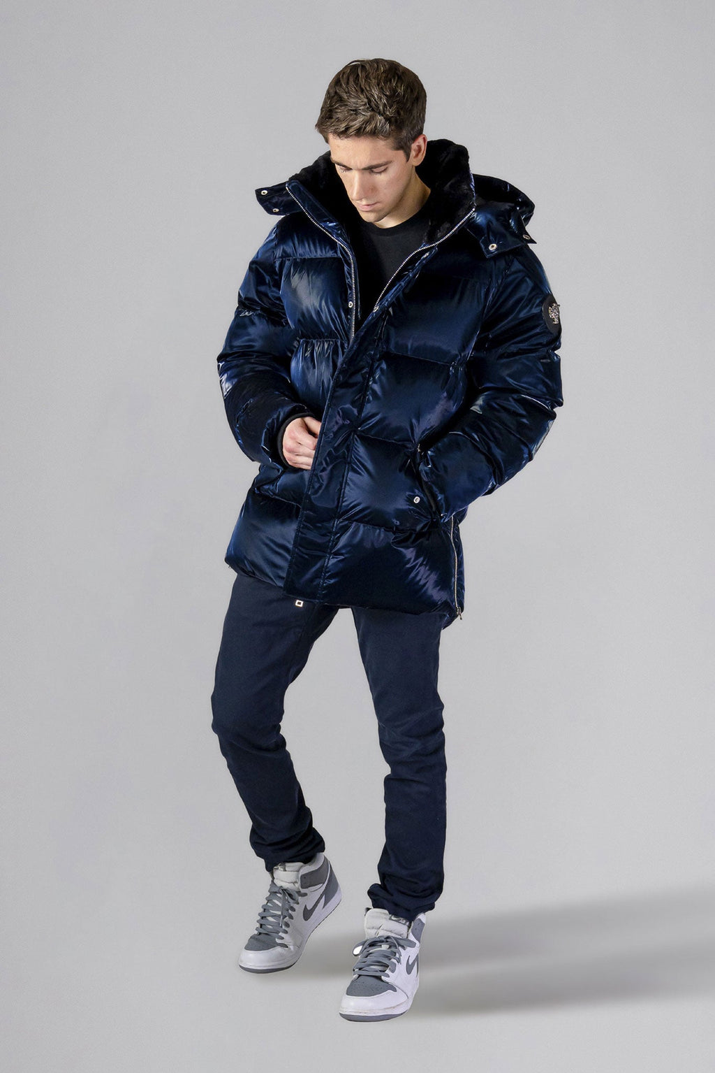 Woodpecker Men's Bumnester Winter coat. High-end Canadian designer winter coat for men in "All Wet Navy" colour. Woodpecker cruelty-free winter coat designed in Canada. Men's heavy weight medium length premium designer jacket for winter. Superior quality warm winter coat for men. Moose Knuckles, Canada Goose, Mackage, Montcler, Will Poho, Willbird, Nic Bayley. Shiny parka. Stylish winter jacket. Designer winter coat.