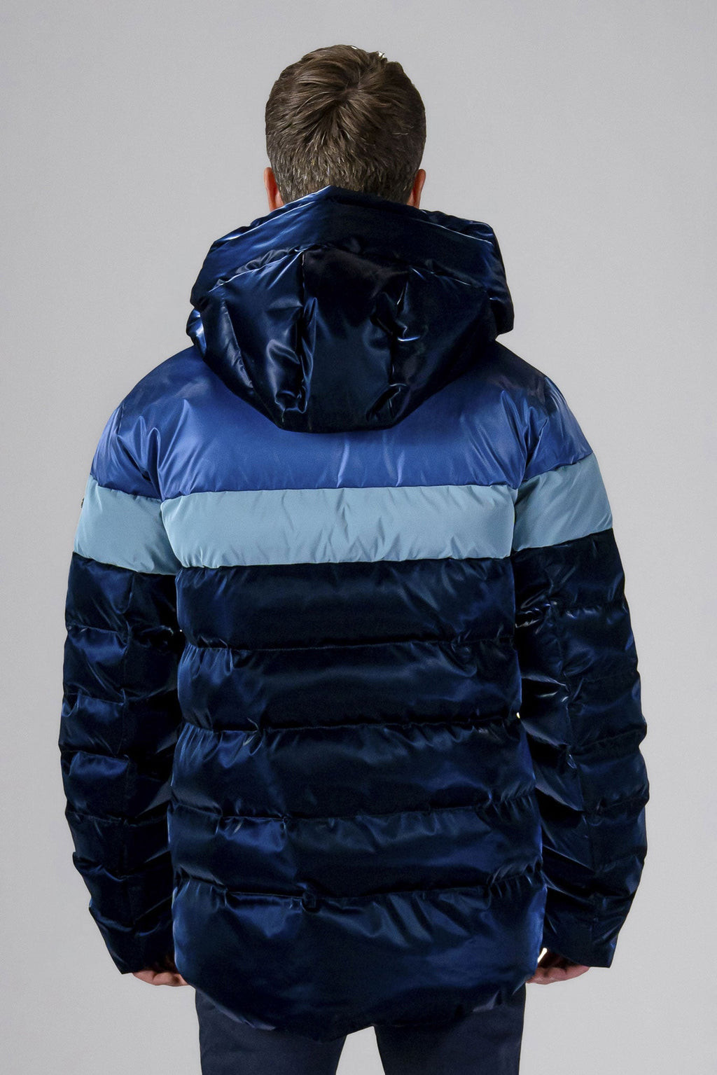 Woodpecker Men's Sparrow Winter coat. High-end Canadian designer winter coat for men in "Blue Steel" colour. Woodpecker cruelty-free winter coat designed in Canada. Men's medium weight medium length premium designer jacket for winter. Superior quality warm winter coat for men. Moose Knuckles, Canada Goose, Mackage, Montcler, Will Poho, Willbird, Nic Bayley. Shiny parka. Stylish winter jacket. Designer winter coat.