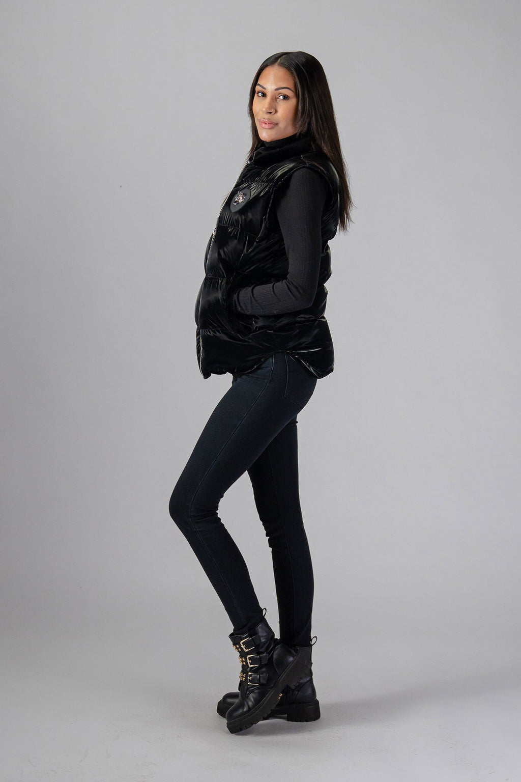 Woodpecker Unisex Winter Vest. High-end Canadian designer winter vest in "All Wet Black" colour. Woodpecker cruelty-free vest designed in Canada. Heavy weight short length premium designer vest for winter. Superior quality warm winter vest. Moose Knuckles, Canada Goose, Mackage, Montcler, Will Poho, Willbird, Nic Bayley. Extra warm. Shiny vest. Stylish winter vest. Designer winter vest.