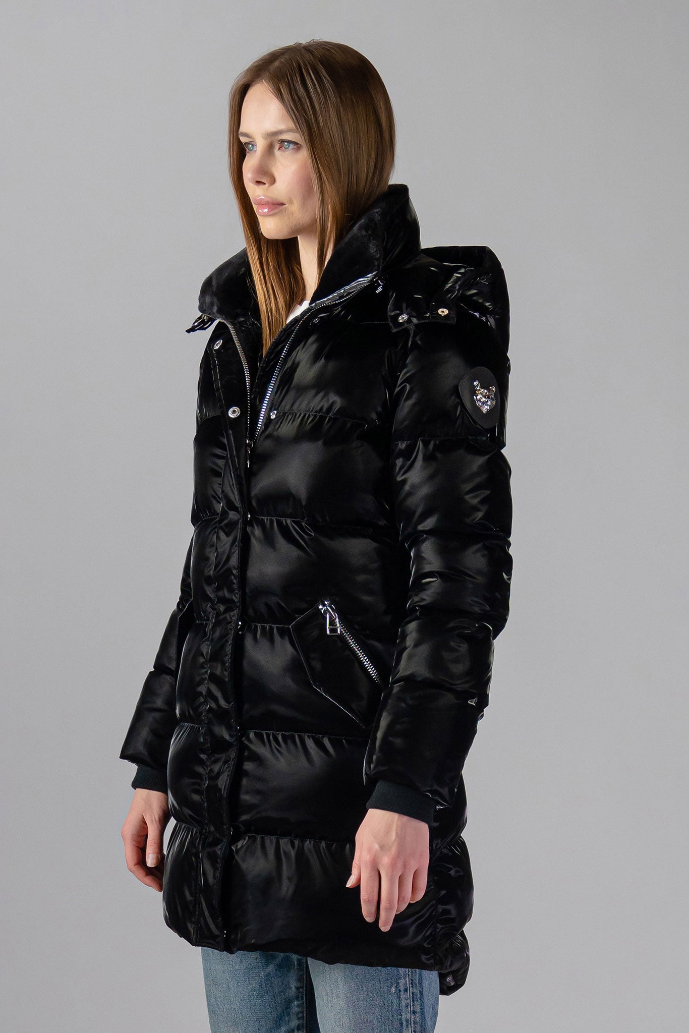 Woodpecker Women's Penguin Long Winter coat. High-end Canadian designer winter coat for women in "All Wet Black" colour. Woodpecker cruelty-free winter coat designed in Canada. Women's heavy weight long length premium designer jacket for winter. Superior quality warm winter coat for women. Moose Knuckles, Canada Goose, Mackage, Montcler, Will Poho, Willbird, Nic Bayley. Extra warm. Shiny parka. Stylish winter jacket. Designer winter coat.