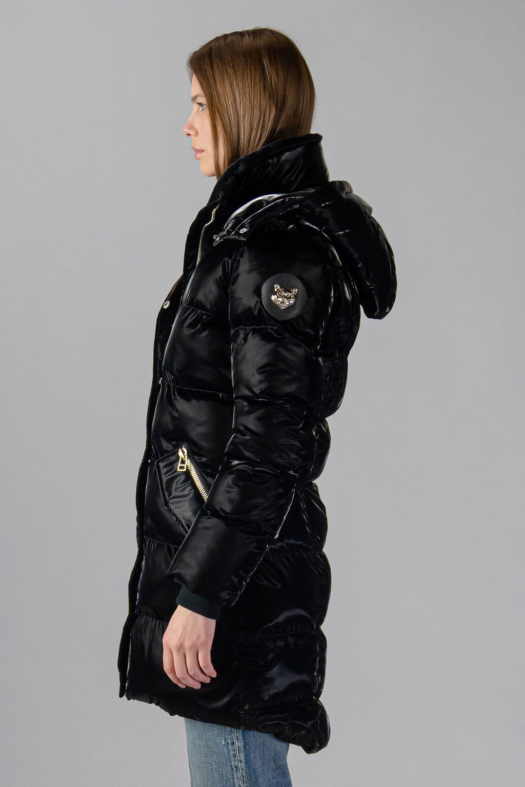 Woodpecker Women's Penguin Long Winter coat. High-end Canadian designer winter coat for women in "All Wet Black" colour. Woodpecker cruelty-free winter coat designed in Canada. Women's heavy weight long length premium designer jacket for winter. Superior quality warm winter coat for women. Moose Knuckles, Canada Goose, Mackage, Montcler, Will Poho, Willbird, Nic Bayley. Extra warm. Shiny parka. Stylish winter jacket. Designer winter coat.