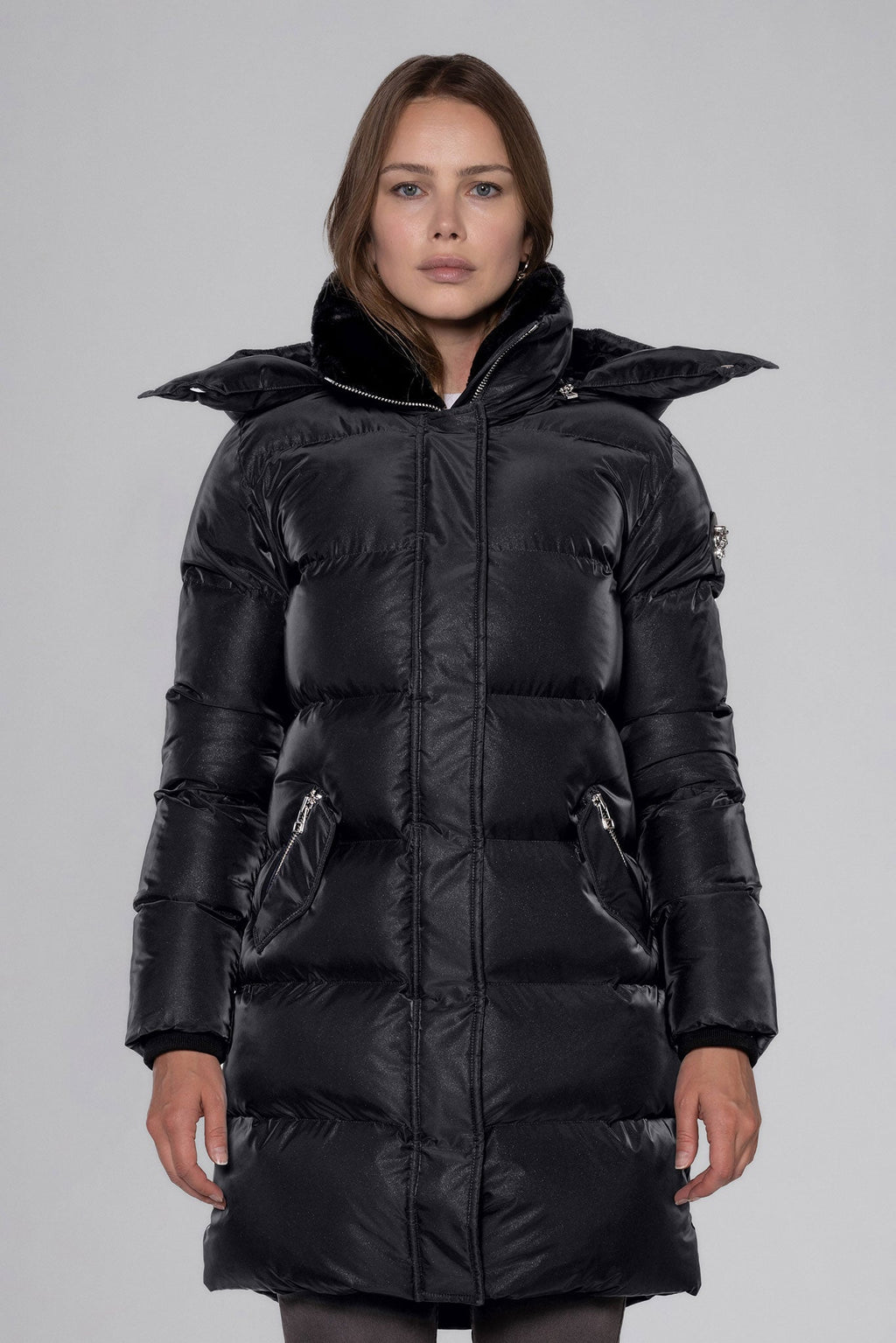 Woodpecker Women's Penguin Long Winter coat. High-end Canadian designer winter coat for women in "Black Diamond" colour. Woodpecker cruelty-free winter coat designed in Canada. Women's heavy weight long length premium designer jacket for winter. Superior quality warm winter coat for women. Moose Knuckles, Canada Goose, Mackage, Montcler, Will Poho, Willbird, Nic Bayley. Extra warm. Shiny parka. Stylish winter jacket. Designer winter coat.