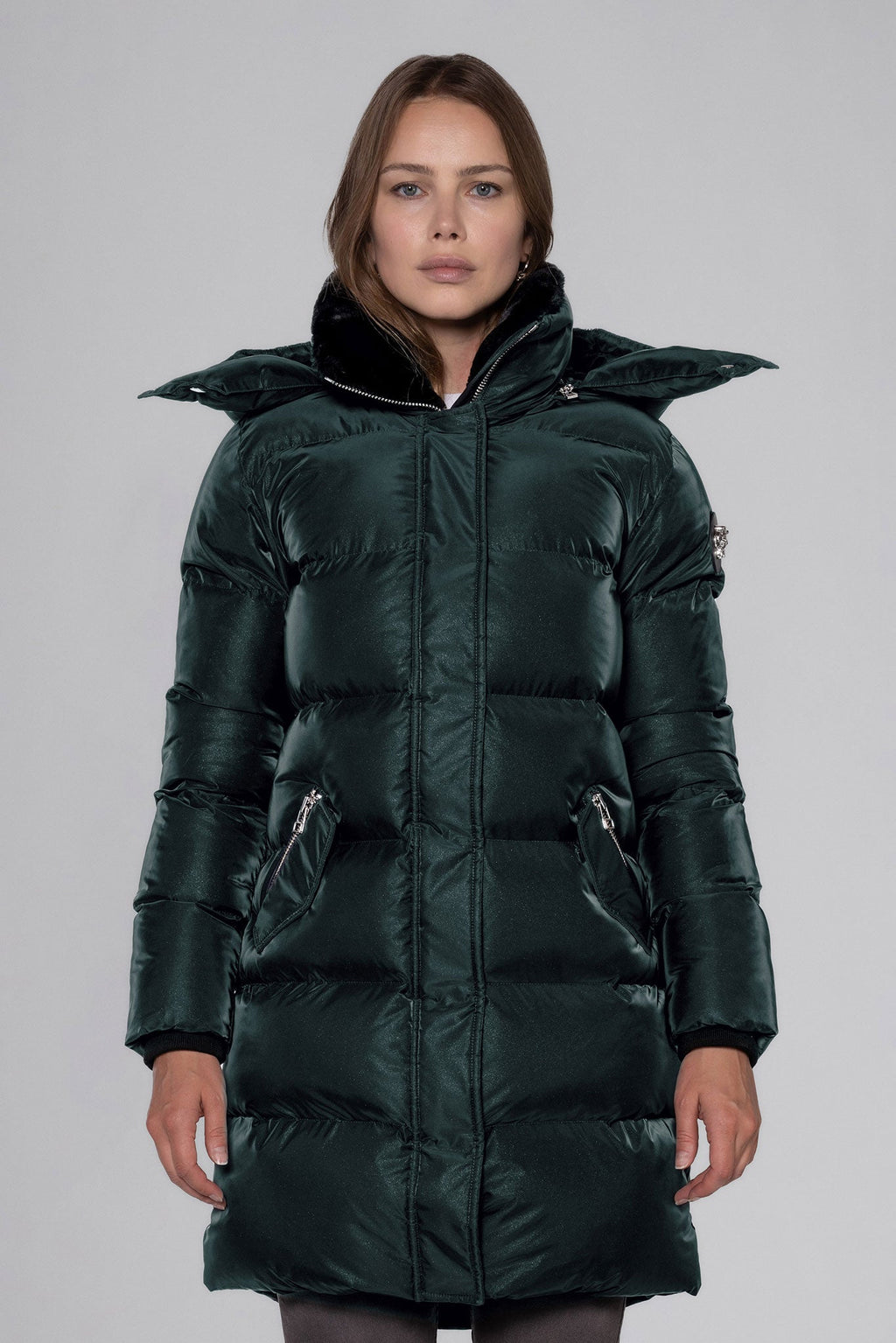 Woodpecker Women's Penguin Long Winter coat. High-end Canadian designer winter coat for women in "Green Diamond" colour. Woodpecker cruelty-free winter coat designed in Canada. Women's heavy weight long length premium designer jacket for winter. Superior quality warm winter coat for women. Moose Knuckles, Canada Goose, Mackage, Montcler, Will Poho, Willbird, Nic Bayley. Extra warm. Shiny parka. Stylish winter jacket. Designer winter coat.