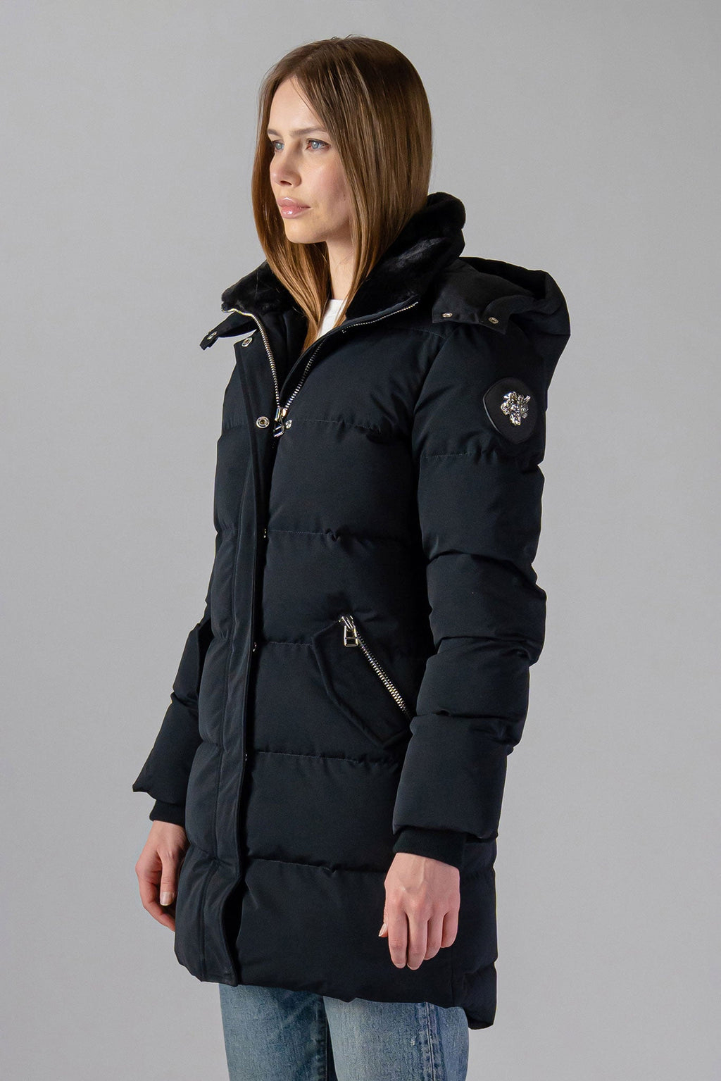 Woodpecker Women's Penguin Long Winter coat. High-end Canadian designer winter coat for women in "Matte Black" colour. Woodpecker cruelty-free winter coat designed in Canada. Women's heavy weight long length premium designer jacket for winter. Superior quality warm winter coat for women. Moose Knuckles, Canada Goose, Mackage, Montcler, Will Poho, Willbird, Nic Bayley. Extra warm. Shiny parka. Stylish winter jacket. Designer winter coat.