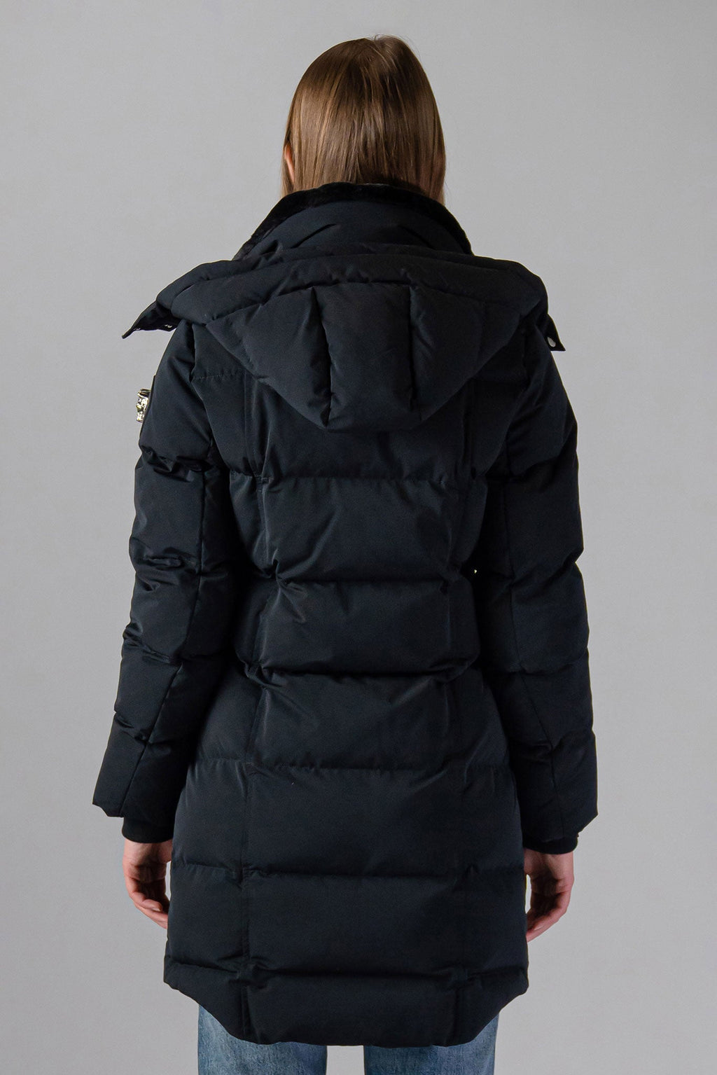 Woodpecker Women's Penguin Long Winter coat. High-end Canadian designer winter coat for women in "Matte Black" colour. Woodpecker cruelty-free winter coat designed in Canada. Women's heavy weight long length premium designer jacket for winter. Superior quality warm winter coat for women. Moose Knuckles, Canada Goose, Mackage, Montcler, Will Poho, Willbird, Nic Bayley. Extra warm. Shiny parka. Stylish winter jacket. Designer winter coat.