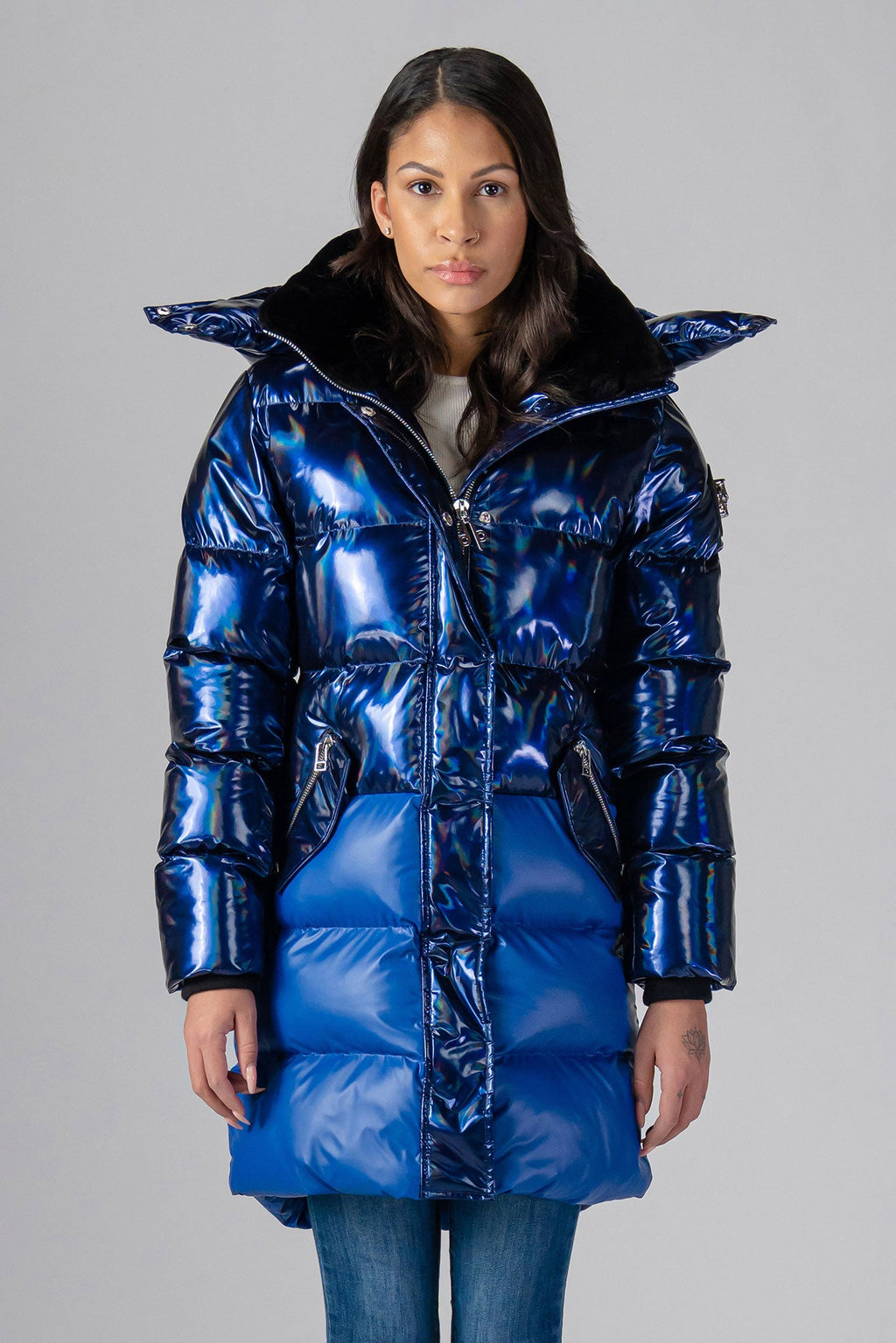 Woodpecker Women's Penguin Long Winter coat. High-end Canadian designer winter coat for women in "Oily Blue Blue" colour. Woodpecker cruelty-free winter coat designed in Canada. Women's heavy weight long length premium designer jacket for winter. Superior quality warm winter coat for women. Moose Knuckles, Canada Goose, Mackage, Montcler, Will Poho, Willbird, Nic Bayley. Extra warm. Shiny parka. Stylish winter jacket. Designer winter coat.