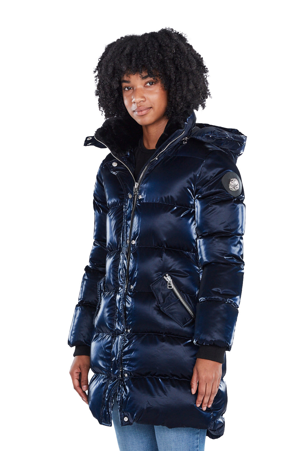 Woodpecker Women's Penguin Long Winter coat. High-end Canadian designer winter coat for women in shiny "All Wet Navy" blue colour. Woodpecker cruelty-free winter coat designed in Canada. Women's heavy weight long length premium designer jacket for winter. Superior quality warm winter coat for women. Moose Knuckles, Canada Goose, Mackage, Montcler, Will Poho, Willbird, Nic Bayley. Extra warm. Shiny parka. Stylish winter jacket. Designer winter coat.