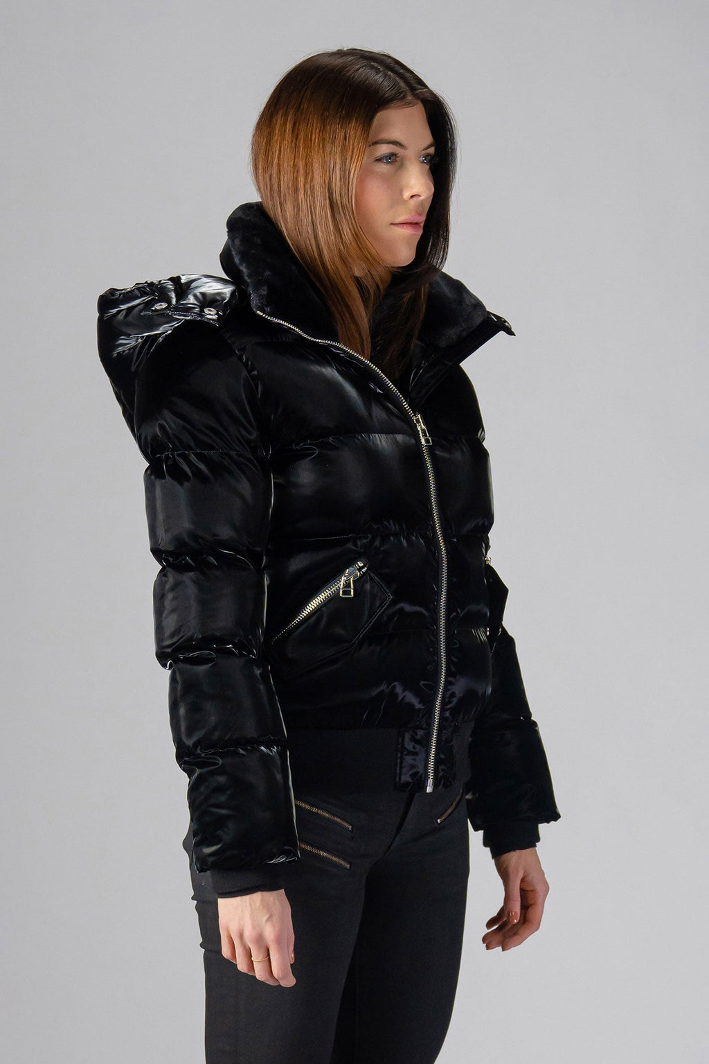 Woodpecker Women's Woody Bomber Winter coat. High-end Canadian designer winter coat for women in shiny “All Wet Black". Woodpecker cruelty-free winter coat designed in Canada. Women's heavy weight short length premium designer jacket for winter. Superior quality warm winter coat for women. Moose Knuckles, Canada Goose, Mackage, Montcler, Will Poho, Willbird, Nic Bayley. Shiny parka. Stylish winter jacket. Designer winter coat.