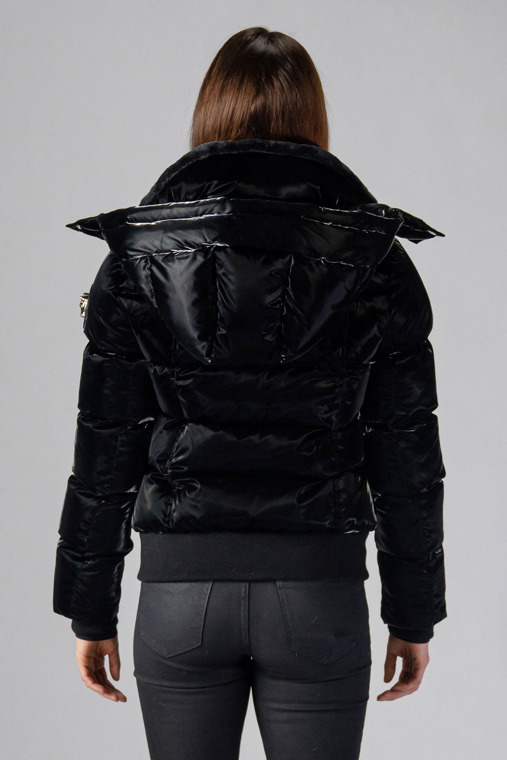 Woodpecker Women's Woody Bomber Winter coat. High-end Canadian designer winter coat for women in shiny “All Wet Black". Woodpecker cruelty-free winter coat designed in Canada. Women's heavy weight short length premium designer jacket for winter. Superior quality warm winter coat for women. Moose Knuckles, Canada Goose, Mackage, Montcler, Will Poho, Willbird, Nic Bayley. Shiny parka. Stylish winter jacket. Designer winter coat.