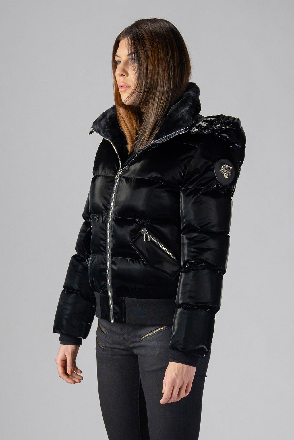 Woodpecker Women's Woody Bomber Winter coat. High-end Canadian designer winter coat for women in shiny “All Wet Black". Woodpecker cruelty-free winter coat designed in Canada. Women's heavy weight short length premium designer jacket for winter. Superior quality warm winter coat for women. Moose Knuckles, Canada Goose, Mackage, Montcler, Will Poho, Willbird, Nic Bayley. Shiny parka. Stylish winter jacket. Designer winter coat.