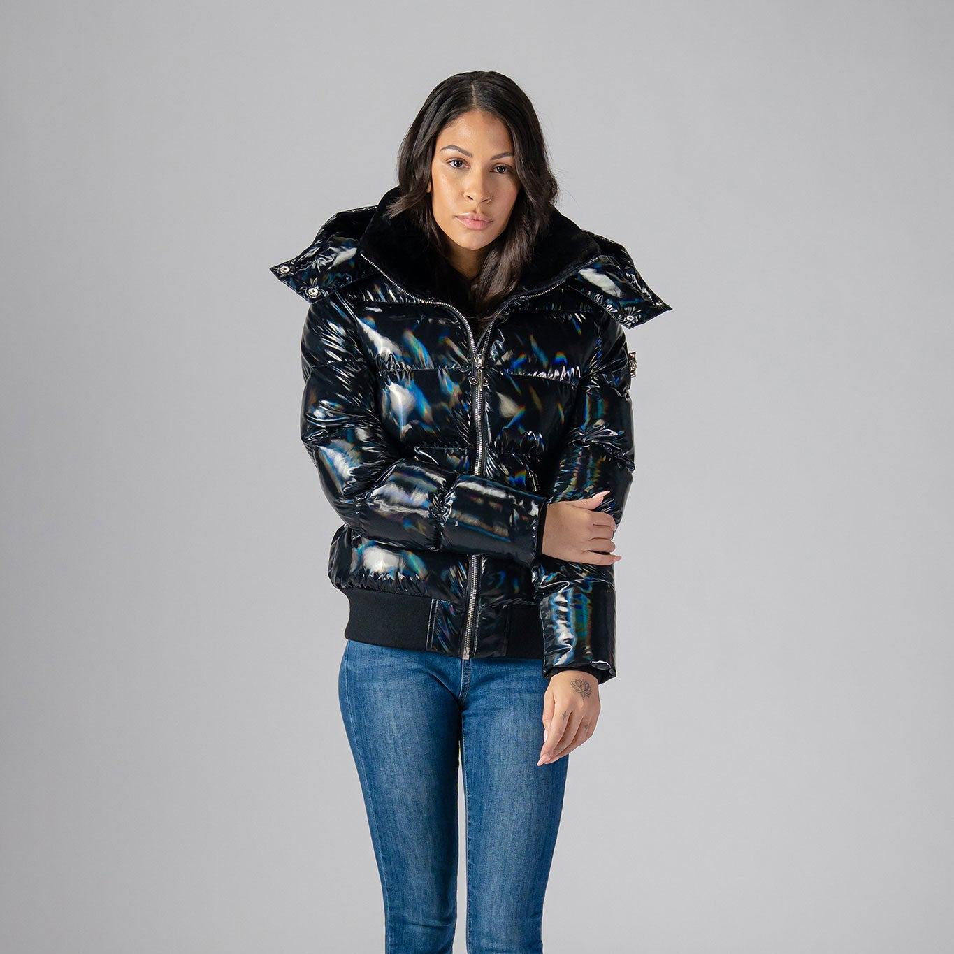 Woodpecker Women's Woody Bomber Winter coat. High-end Canadian designer winter coat for women in "Oily Black" colour. Woodpecker cruelty-free winter coat designed in Canada. Women's heavy weight short length premium designer jacket for winter. Superior quality warm winter coat for women. Moose Knuckles, Canada Goose, Mackage, Montcler, Will Poho, Willbird, Nic Bayley. Shiny parka. Stylish winter jacket. Designer winter coat.