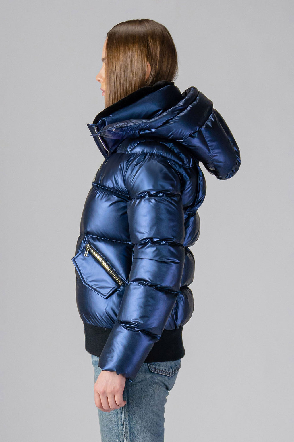 Woodpecker Women's Woody Bomber Winter coat. High-end Canadian designer winter coat for women in "Sapphire" colour. Woodpecker cruelty-free winter coat designed in Canada. Women's heavy weight short length premium designer jacket for winter. Superior quality warm winter coat for women. Moose Knuckles, Canada Goose, Mackage, Montcler, Will Poho, Willbird, Nic Bayley. Shiny parka. Stylish winter jacket. Designer winter coat.