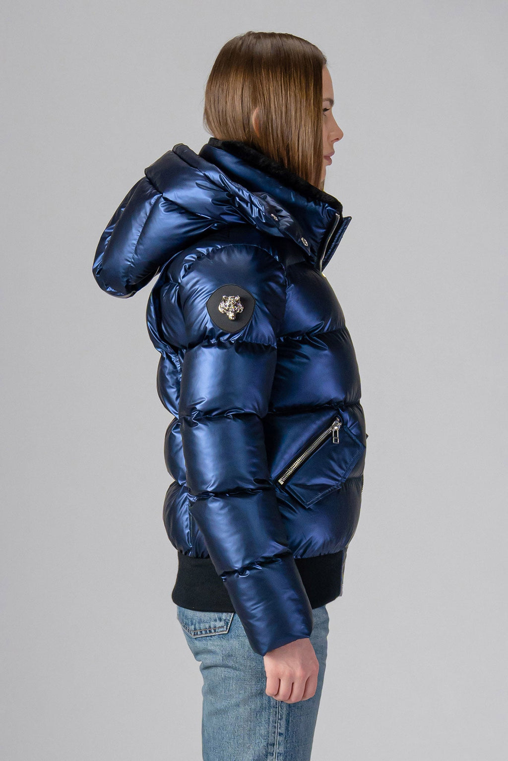 Woodpecker Women's Woody Bomber Winter coat. High-end Canadian designer winter coat for women in "Sapphire" colour. Woodpecker cruelty-free winter coat designed in Canada. Women's heavy weight short length premium designer jacket for winter. Superior quality warm winter coat for women. Moose Knuckles, Canada Goose, Mackage, Montcler, Will Poho, Willbird, Nic Bayley. Shiny parka. Stylish winter jacket. Designer winter coat.