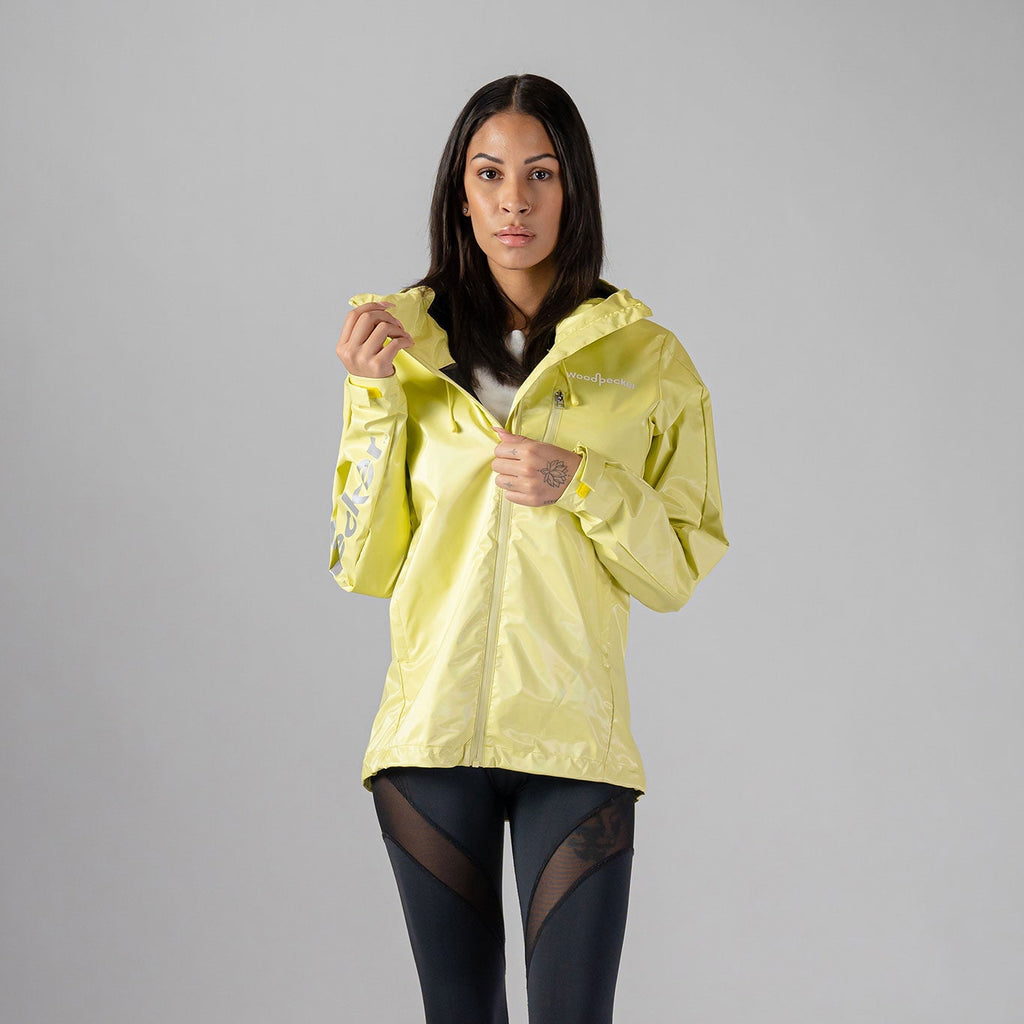 Woodpecker Women's Wind Shell coat. High-end Canadian designer activewear coat for women in "Mellow Yellow" colour. Woodpecker coat designed in Canada. Moose Knuckles, Canada Goose, Mackage, Montcler, Will Poho, Willbird, Nic Bayley.