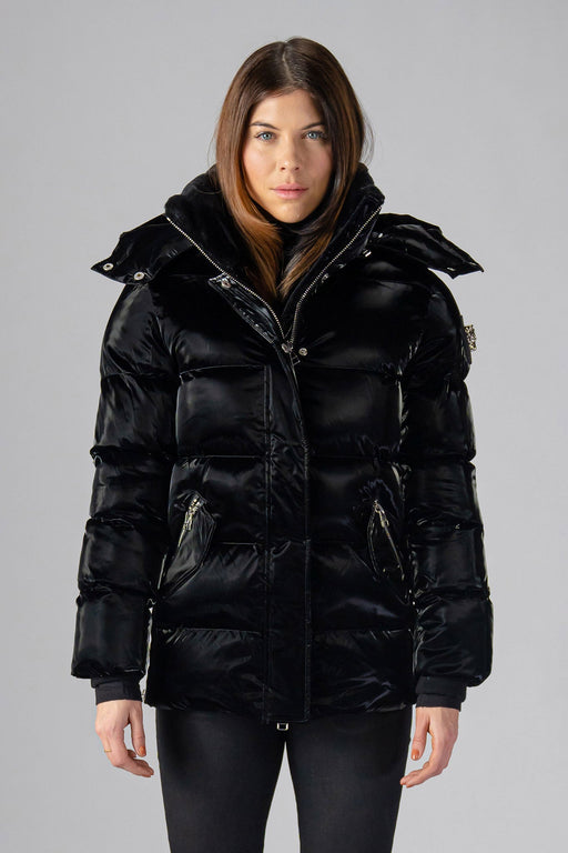 Woodpecker Women's Bumnester Winter coat. High-end Canadian designer winter coat for women in shiny "All Wet Black" colour. Woodpecker cruelty-free winter coat designed in Canada. Women's heavy weight medium length premium designer jacket for winter. Superior quality warm winter coat for women. Moose Knuckles, Canada Goose, Mackage, Montcler, Will Poho, Willbird, Nic Bayley. Extra warm. Shiny parka. Stylish winter jacket. Designer winter coat.