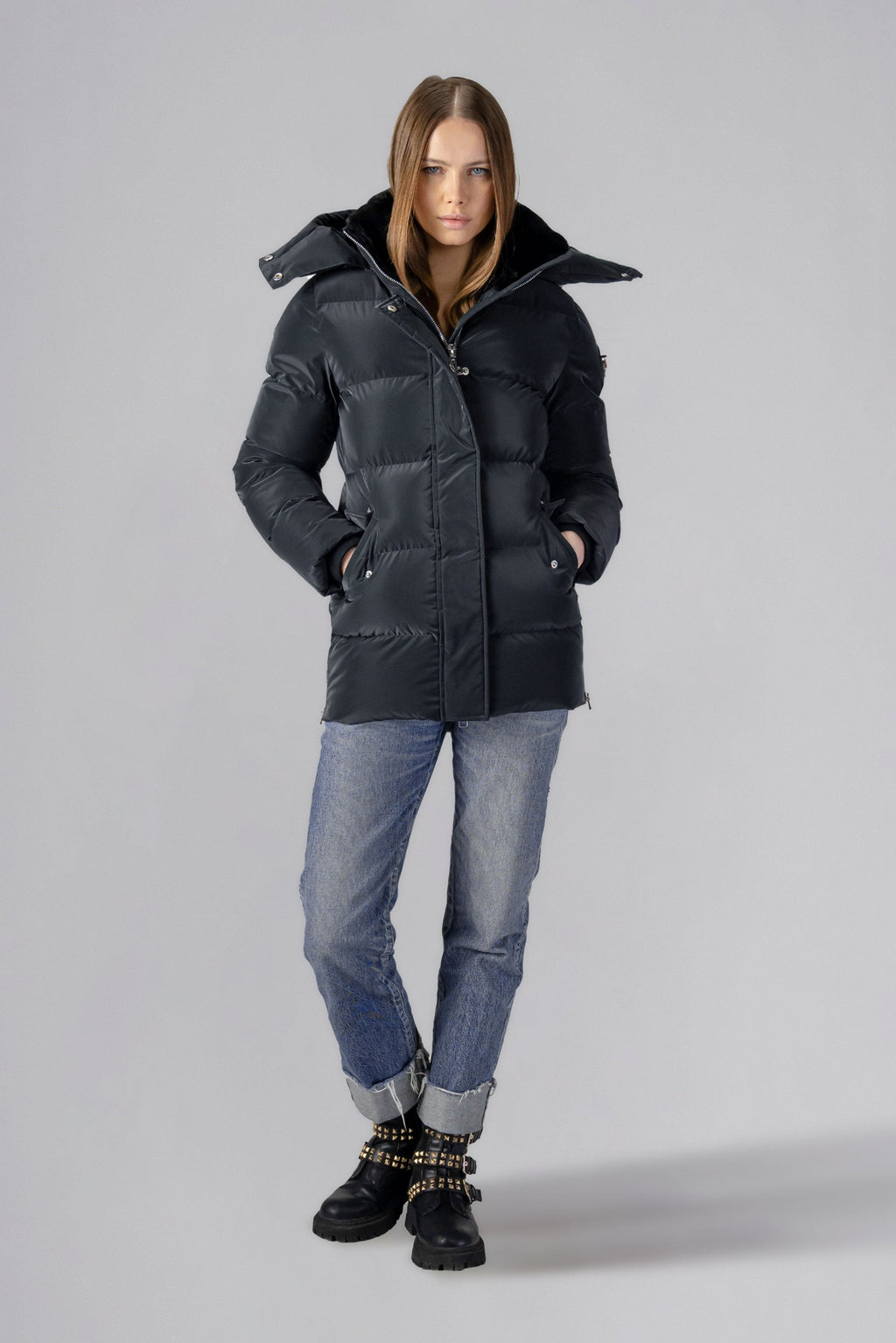 Woodpecker Women's Bumnester Winter coat. High-end Canadian designer winter coat for women in shiny "Black Diamond" colour. Woodpecker cruelty-free winter coat designed in Canada. Women's heavy weight medium length premium designer jacket for winter. Superior quality warm winter coat for women. Moose Knuckles, Canada Goose, Mackage, Montcler, Will Poho, Willbird, Nic Bayley. Extra warm. Shiny parka. Stylish winter jacket. Designer winter coat.