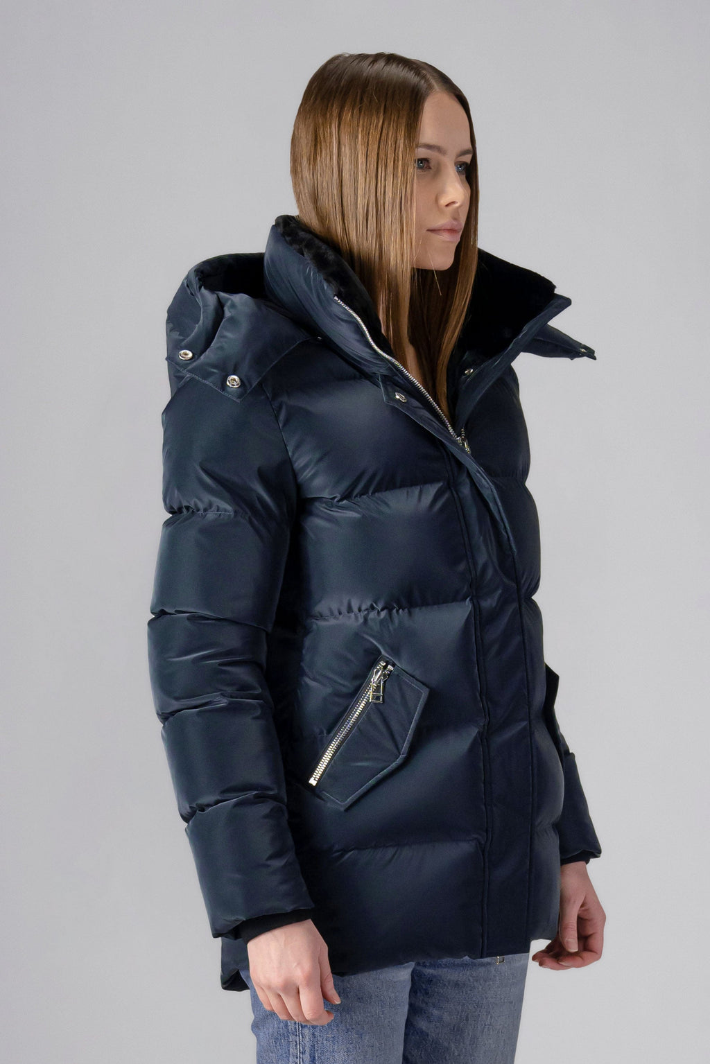Woodpecker Women's Bumnester Winter coat. High-end Canadian designer winter coat for women in shiny "Blue Diamond" colour. Woodpecker cruelty-free winter coat designed in Canada. Women's heavy weight medium length premium designer jacket for winter. Superior quality warm winter coat for women. Moose Knuckles, Canada Goose, Mackage, Montcler, Will Poho, Willbird, Nic Bayley. Extra warm. Shiny parka. Stylish winter jacket. Designer winter coat.